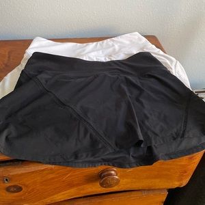 Mondetta. Two tennis skirts! Black and white. Lightly worn.